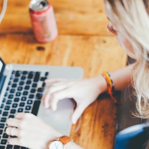woman typing on computer
